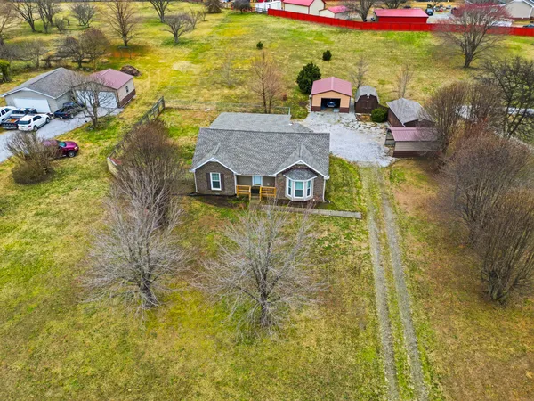 a aerial view of a house with outdoor space