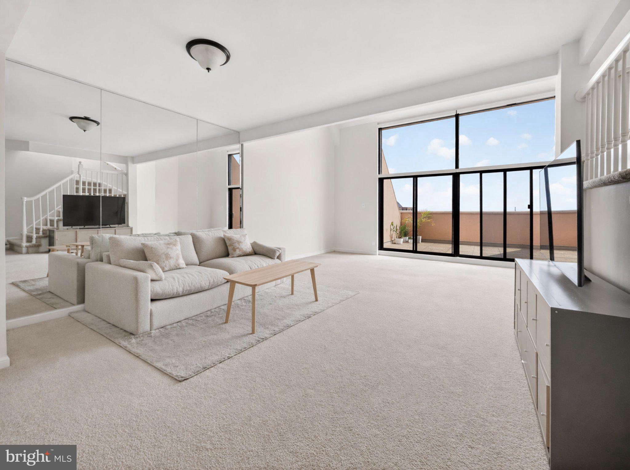 1301 North Courthouse Road, Unit 1803 Arlington, VA 22201 - Photo 13 of 35 Spacious, sunlit living area awaits you.