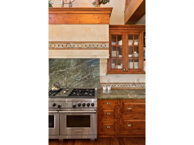 a stove top oven sitting inside of a kitchen