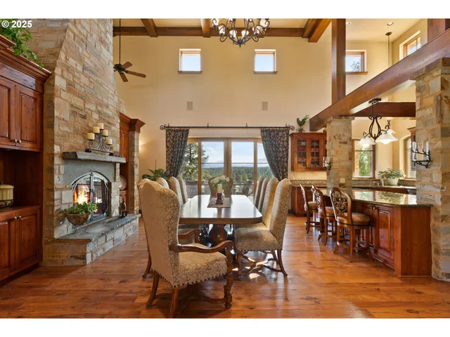 a dining room with lots of wooden furniture