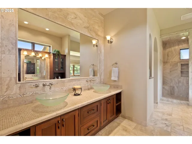 a bathroom with a sink double vanity and a mirror
