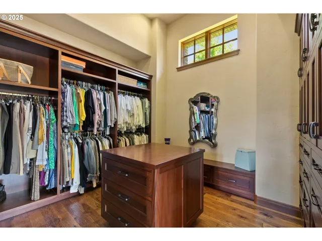 a view of living room with furniture and wooden floor
