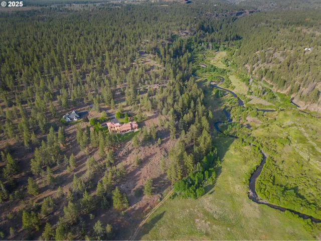 a aerial view of residential houses with yard