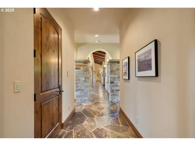 a living room with furniture a bookshelf and a book shelf