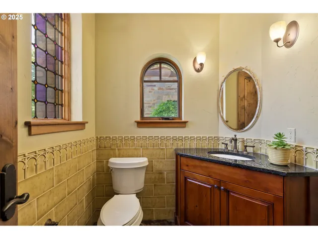 a bedroom with a bed next to a window