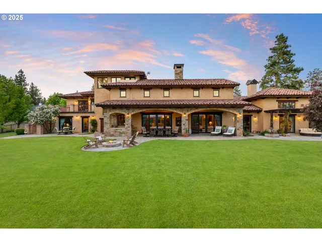a living room with furniture a rug and a fireplace