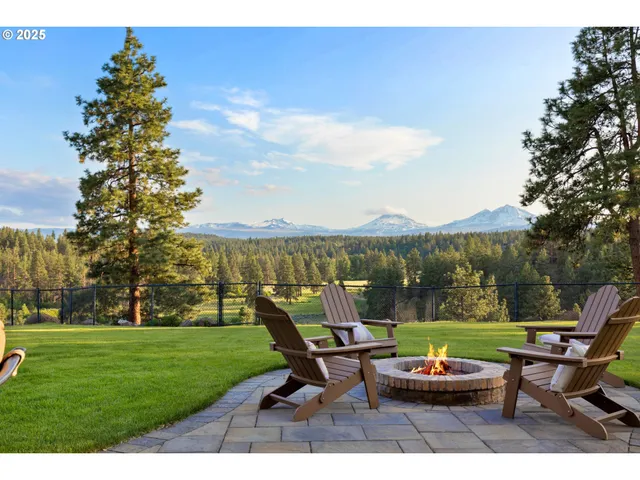 a view of a table and chairs in the garden