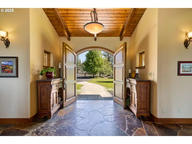 a view of living room with furniture and a fireplace
