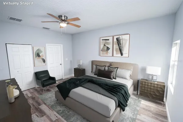 a bedroom with bed and a window