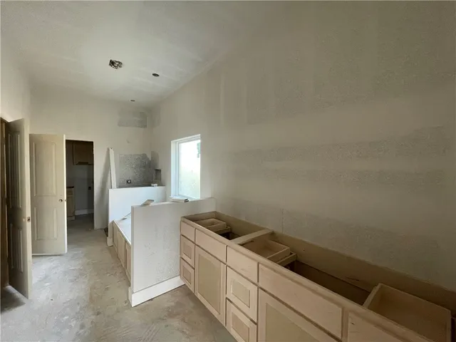 a room with a bed and a window