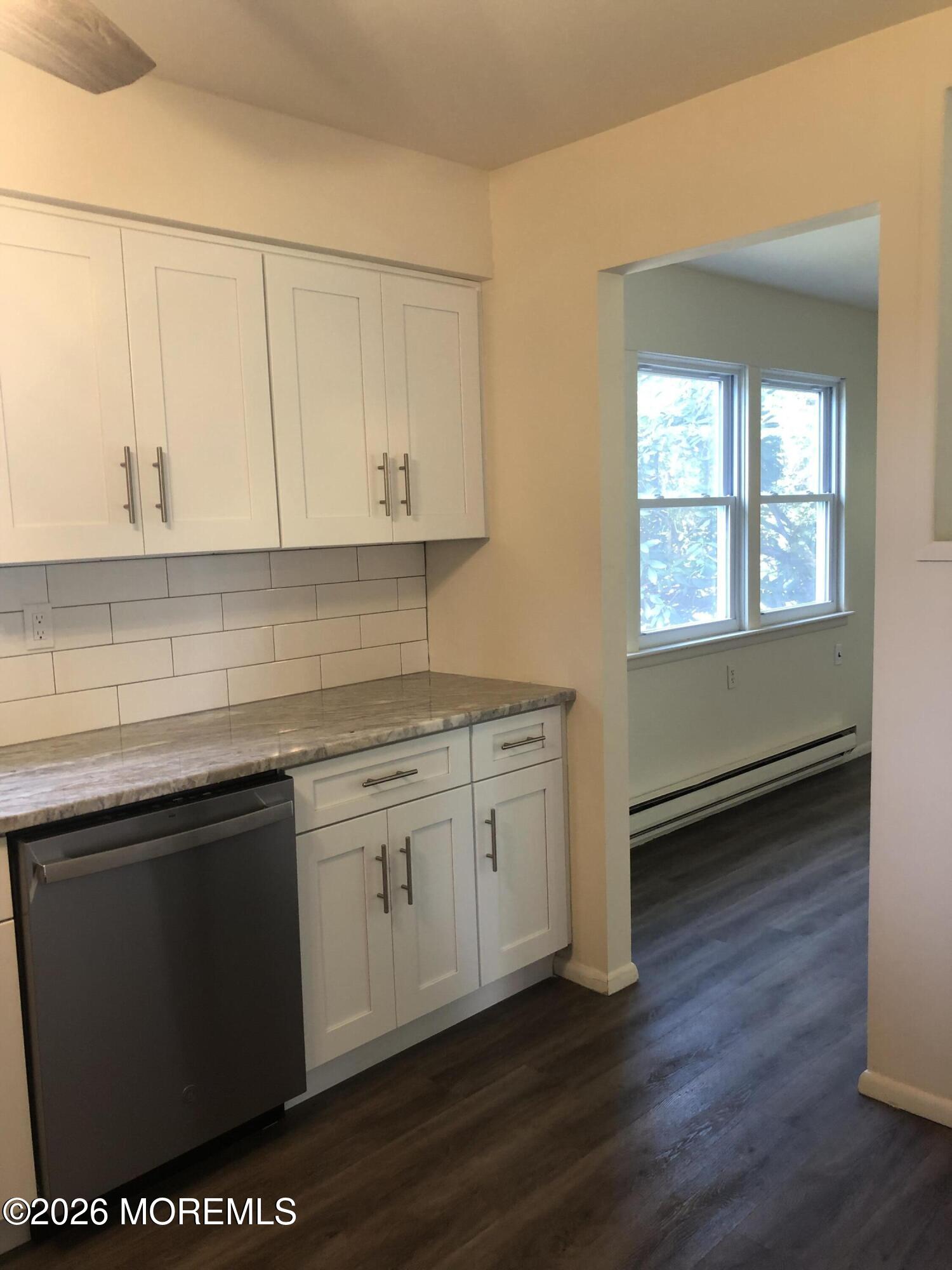 6 Dickinson Road Brick, NJ 08724 - Photo 6 of 17 a kitchen with granite countertop a sink cabinets and a wooden floor