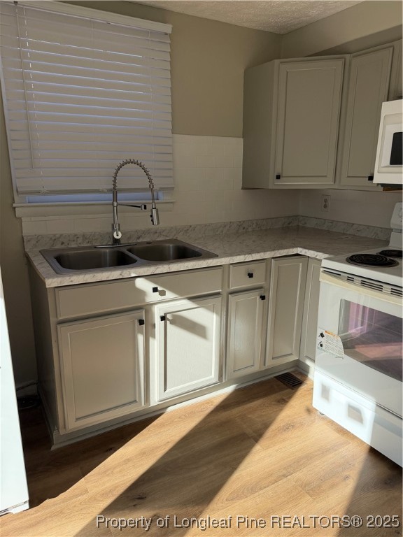 415 Vass Road Spring Lake, NC 28390 - Photo 6 of 12 a kitchen with stainless steel appliances granite countertop a sink a stove and cabinets