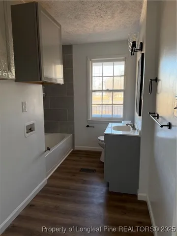 a room with a window and wooden floor