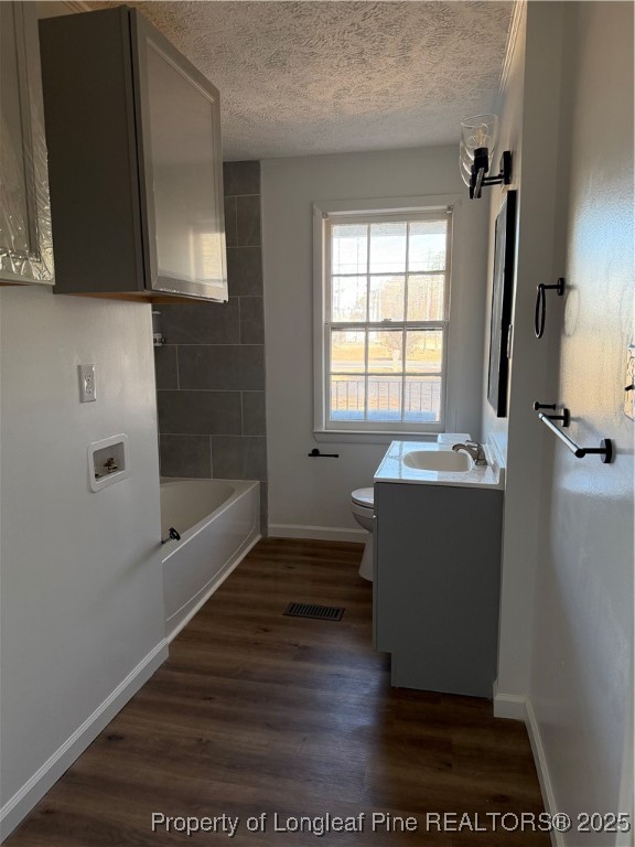 415 Vass Road Spring Lake, NC 28390 - Photo 9 of 12 a room with a window and wooden floor