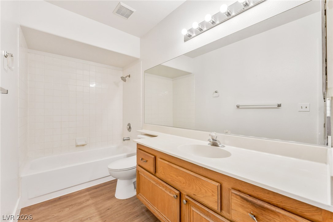 4904 Spring Falls Way North Las Vegas, NV 89031 - Photo 19 of 24 A well-appointed bathroom offers a convenient shower-over-tub combination and a single vanity with ample storage.