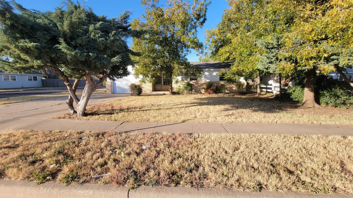 4430 33rd Street Lubbock, TX 79410 - Photo 1 of 1 a view of road with trees