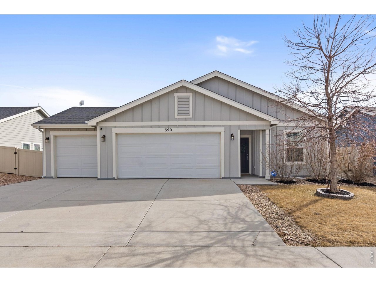 390 Cherokee Trail Ault, CO 80610 - Photo 1 of 37 a front view of a house with a yard
