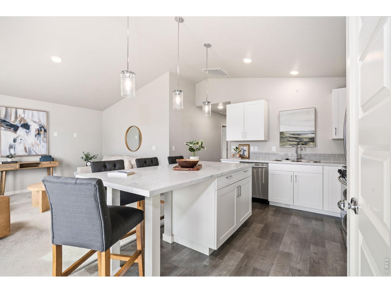390 Cherokee Trail Ault, CO 80610 - Photo 11 of 37 a kitchen with a sink a counter top space and stainless steel appliances
