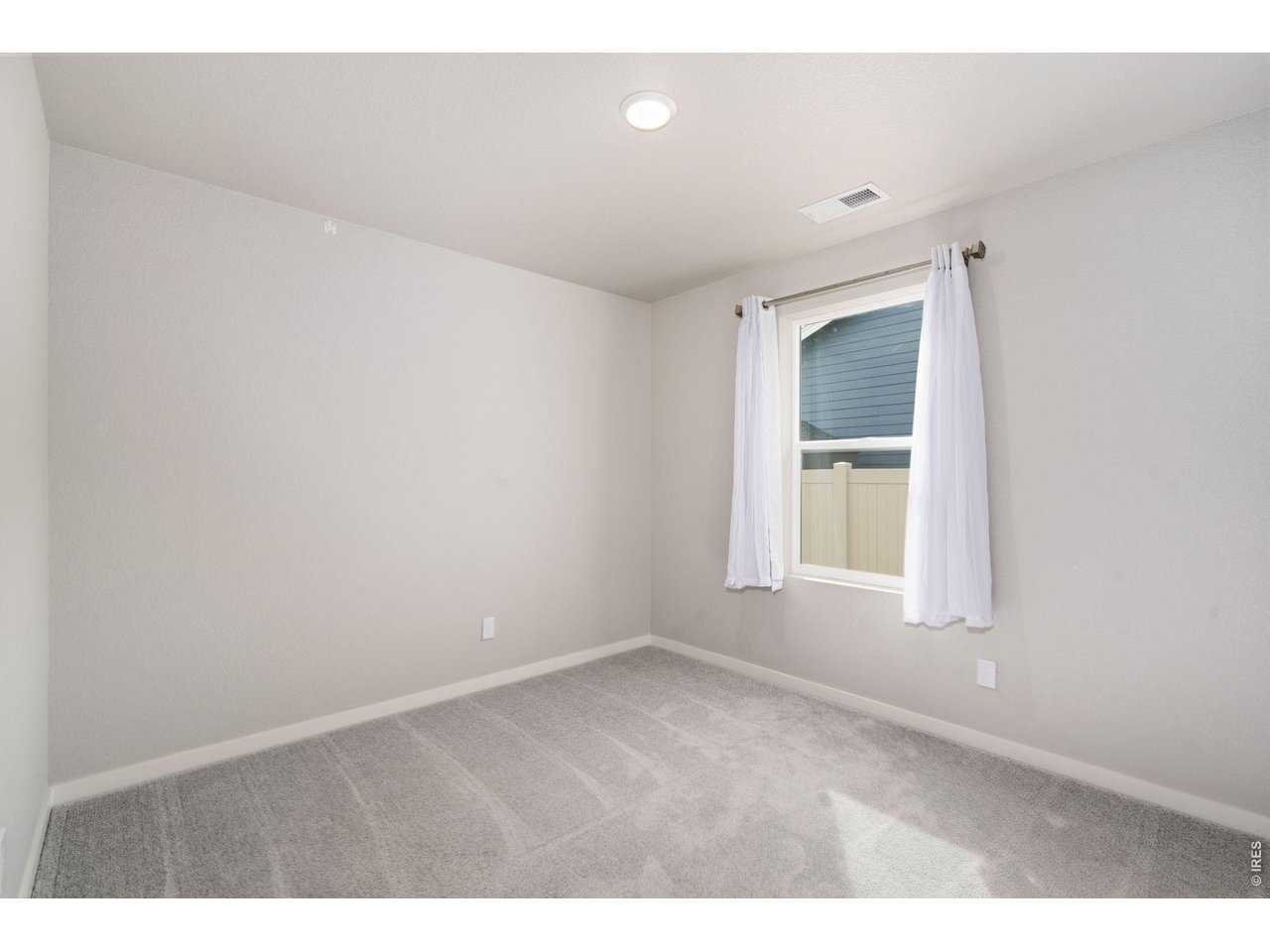 390 Cherokee Trail Ault, CO 80610 - Photo 17 of 37 a view of an empty room with a window