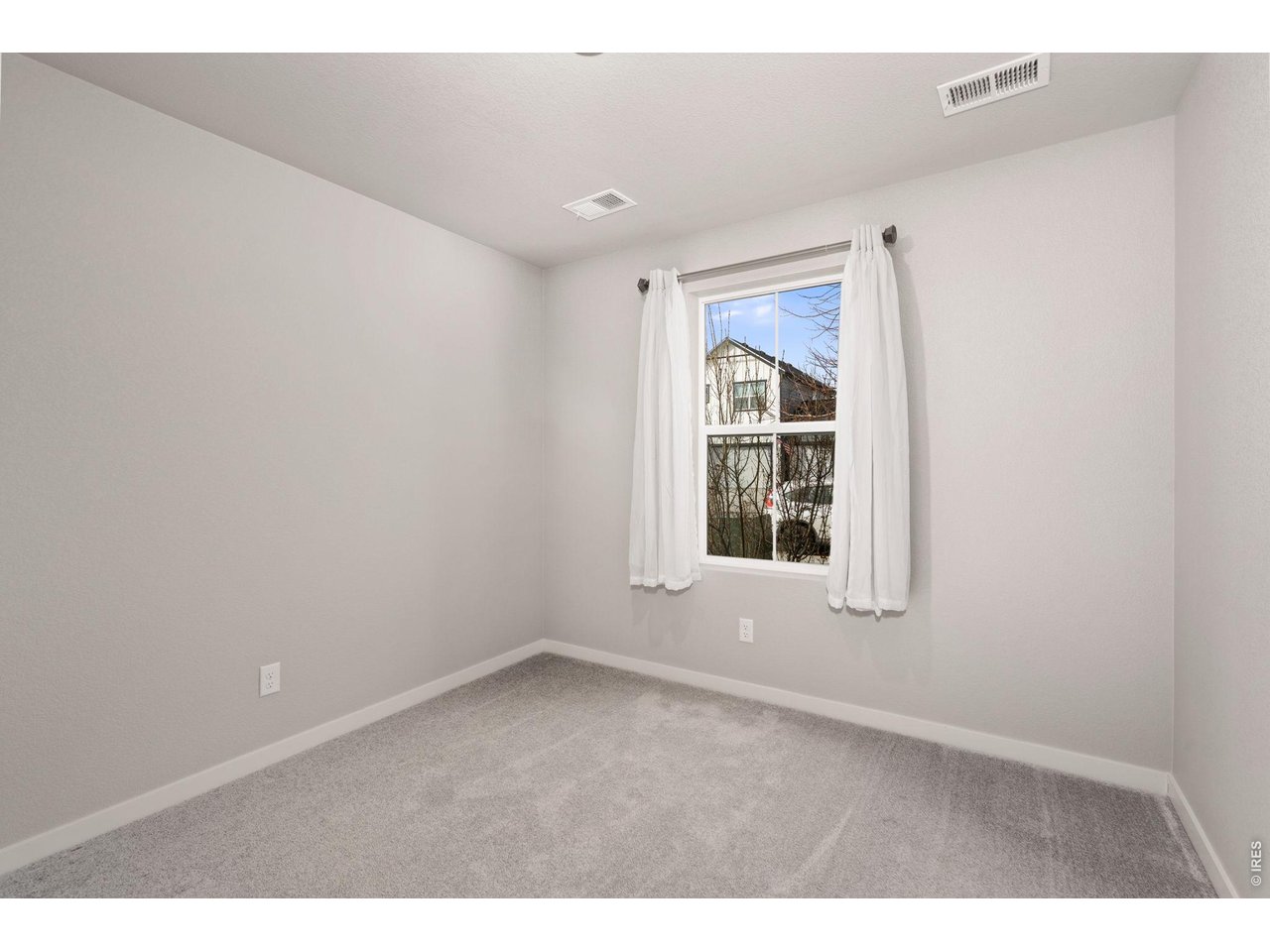 390 Cherokee Trail Ault, CO 80610 - Photo 19 of 37 an empty room with a window