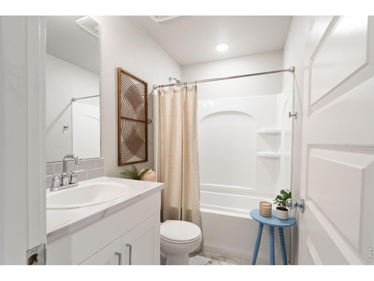 390 Cherokee Trail Ault, CO 80610 - Photo 21 of 37 a bathroom with a sink toilet a mirror and shower
