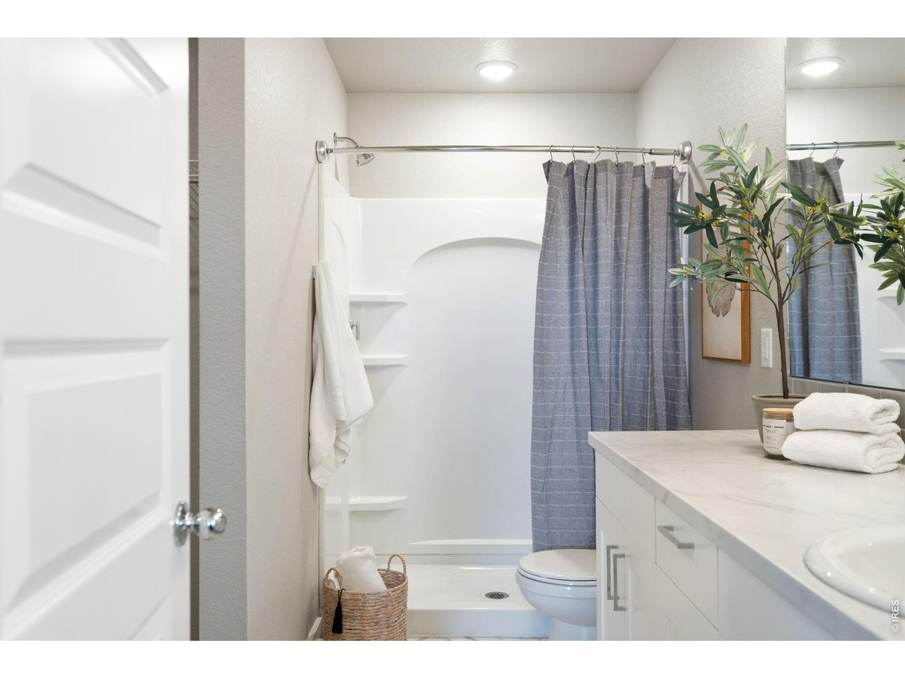 390 Cherokee Trail Ault, CO 80610 - Photo 23 of 37 a bathroom with a shower and a sink