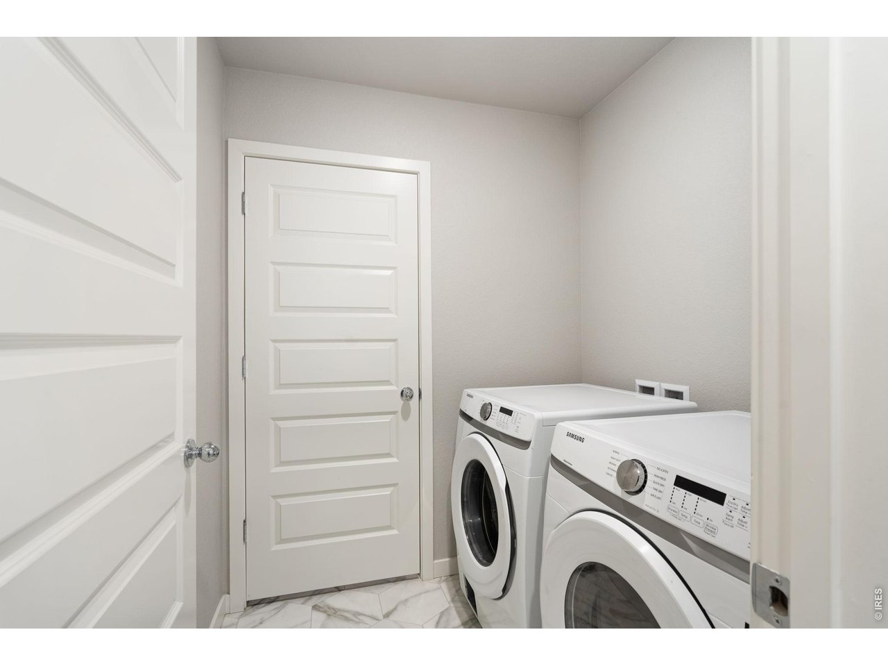 390 Cherokee Trail Ault, CO 80610 - Photo 25 of 37 a utility room with dryer and washer