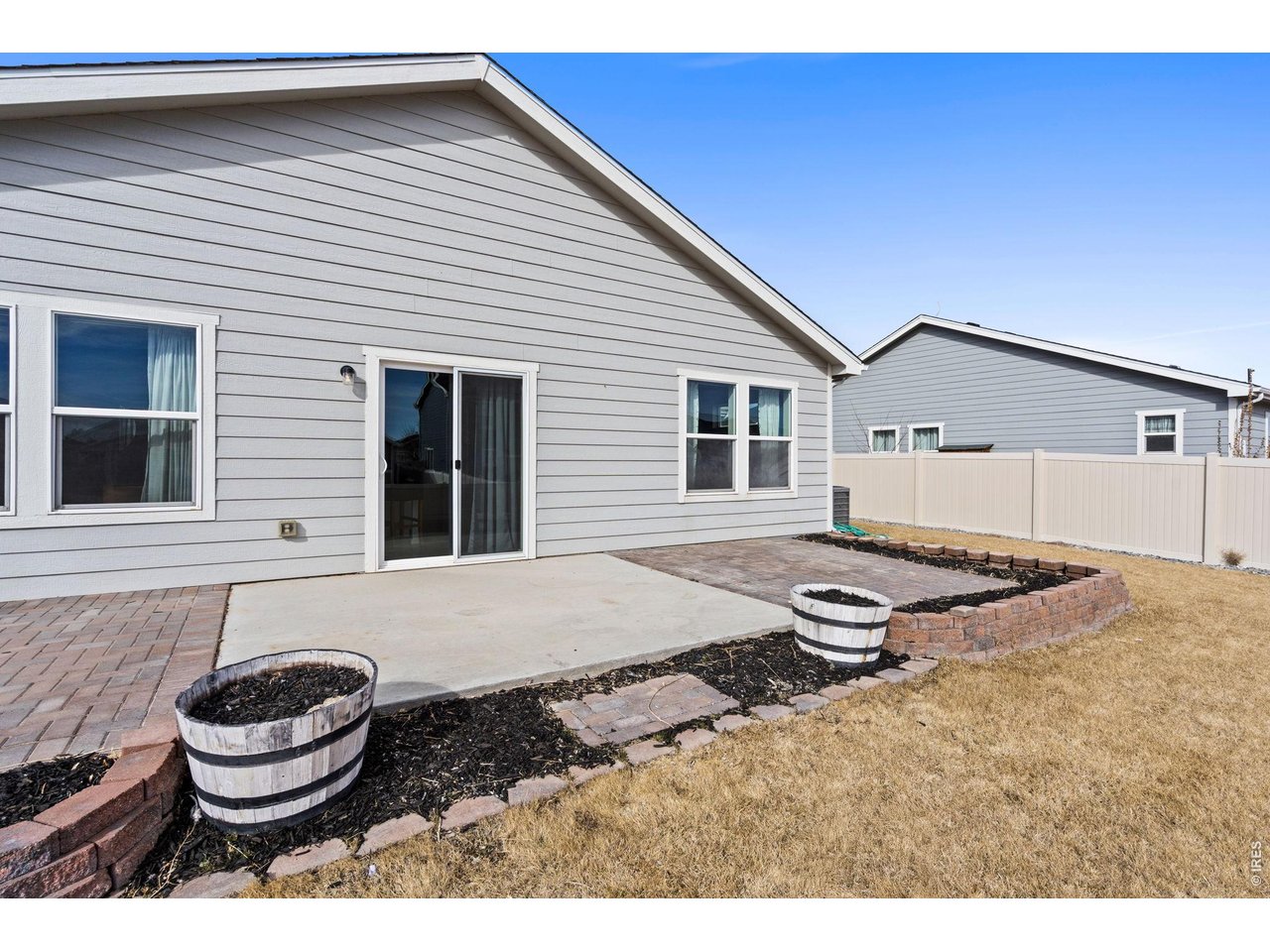 390 Cherokee Trail Ault, CO 80610 - Photo 29 of 37 a front view of a house with a yard and garage
