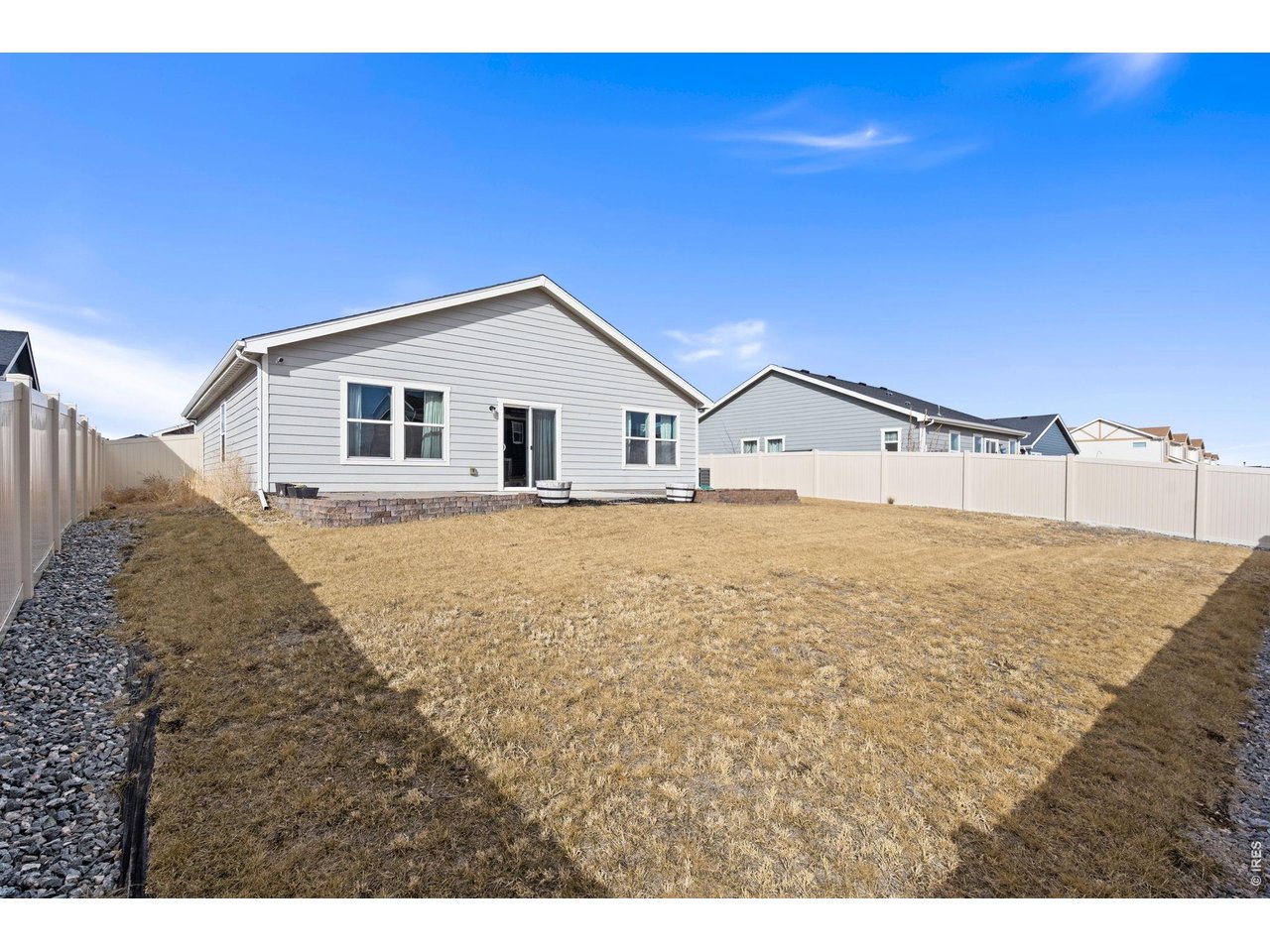 390 Cherokee Trail Ault, CO 80610 - Photo 34 of 37 a view of a house with a backyard