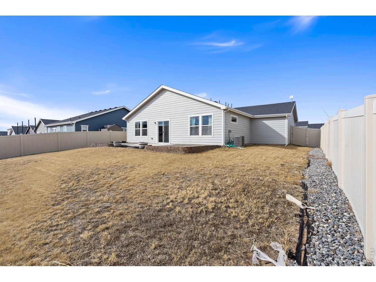 390 Cherokee Trail Ault, CO 80610 - Photo 36 of 37 a view of a house with a yard