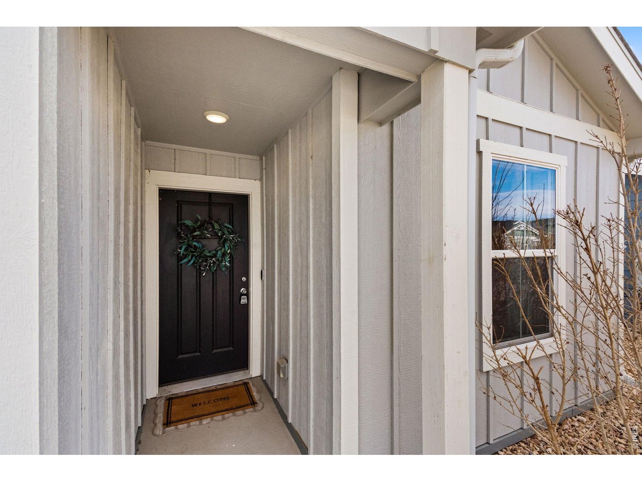 390 Cherokee Trail Ault, CO 80610 - Photo 4 of 37 a view of a hallway with wooden floor and entryway
