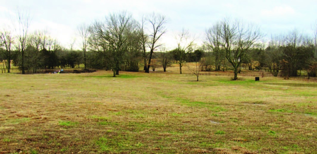 a swimming pool with an outdoor space and seating area