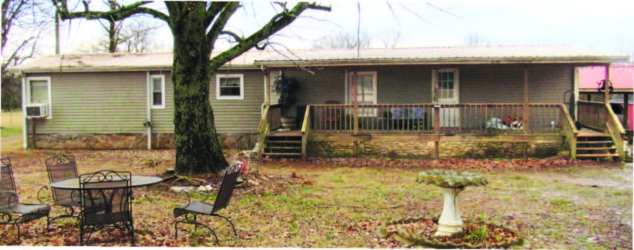 1850 Phillips Road Lebanon, TN 37087 - Photo 3 of 7 a backyard of a house with barbeque oven table and chairs