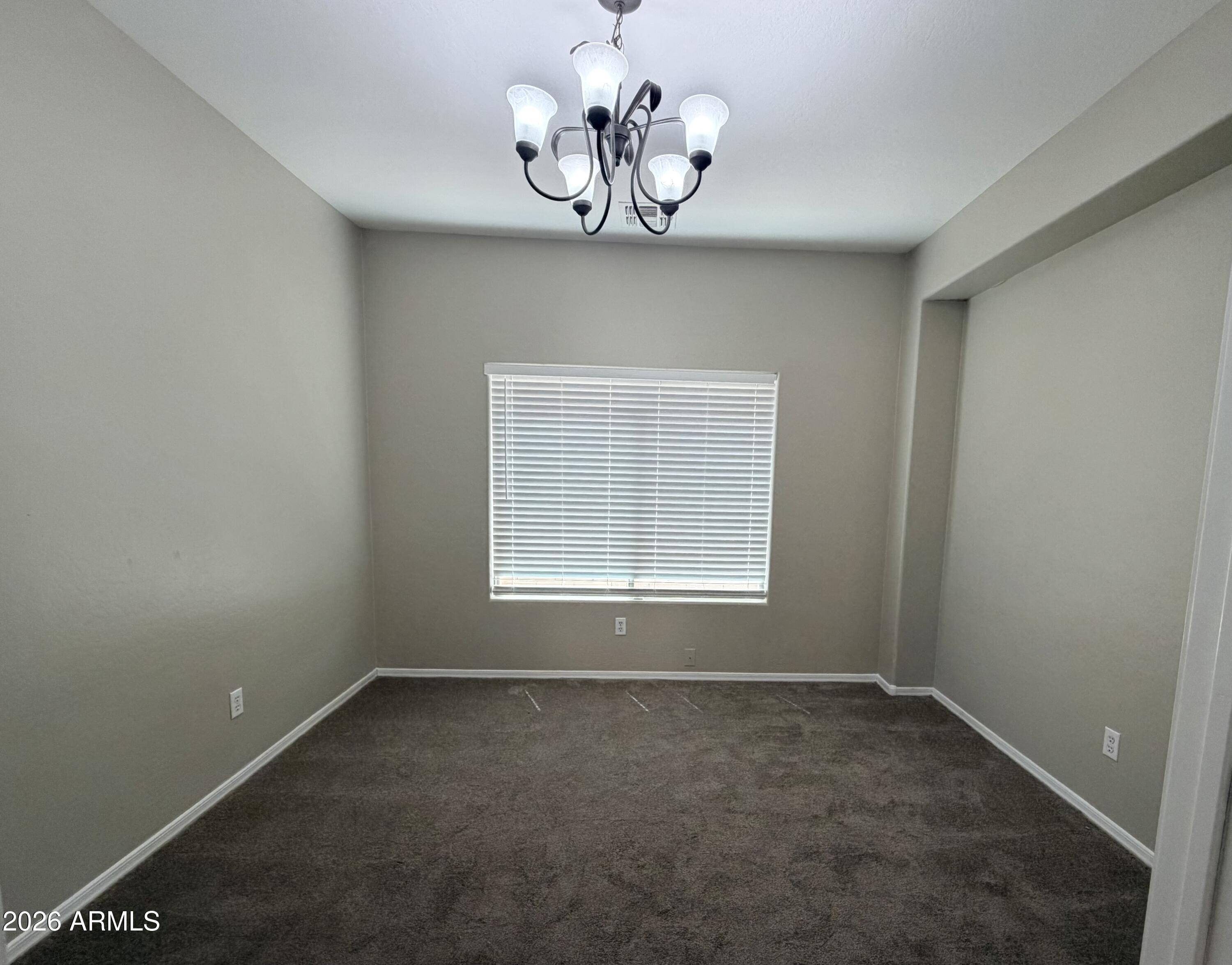 191 West Rio Drive Casa Grande, AZ 85122 - Photo 8 of 34 an empty room with a window