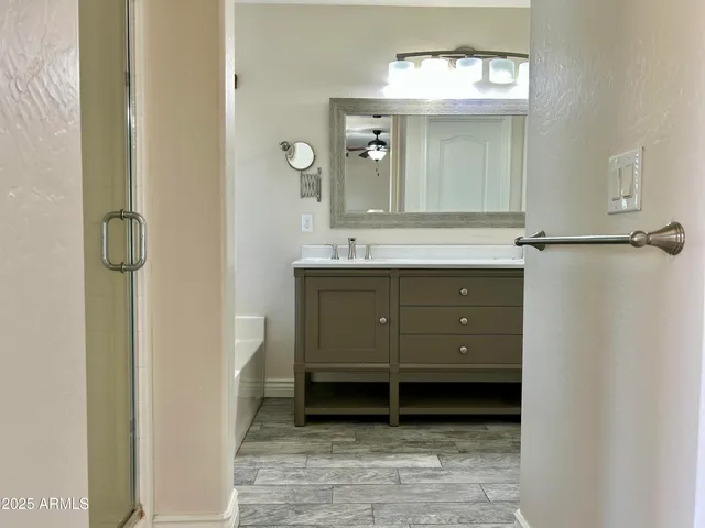 a bathroom with a sink and a mirror