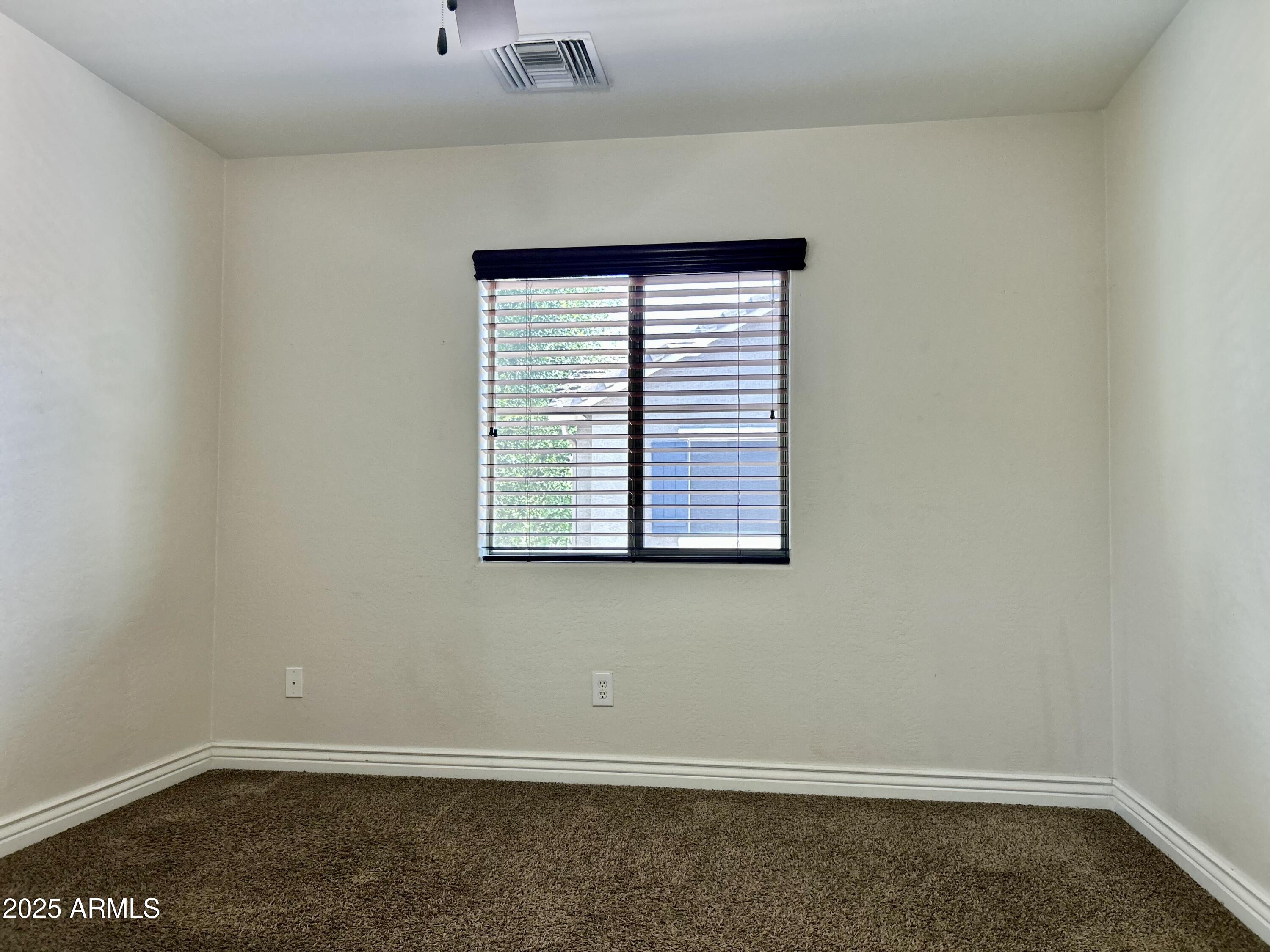 3853 East Santa Fe Lane Gilbert, AZ 85297 - Photo 16 of 23 an empty room with a window