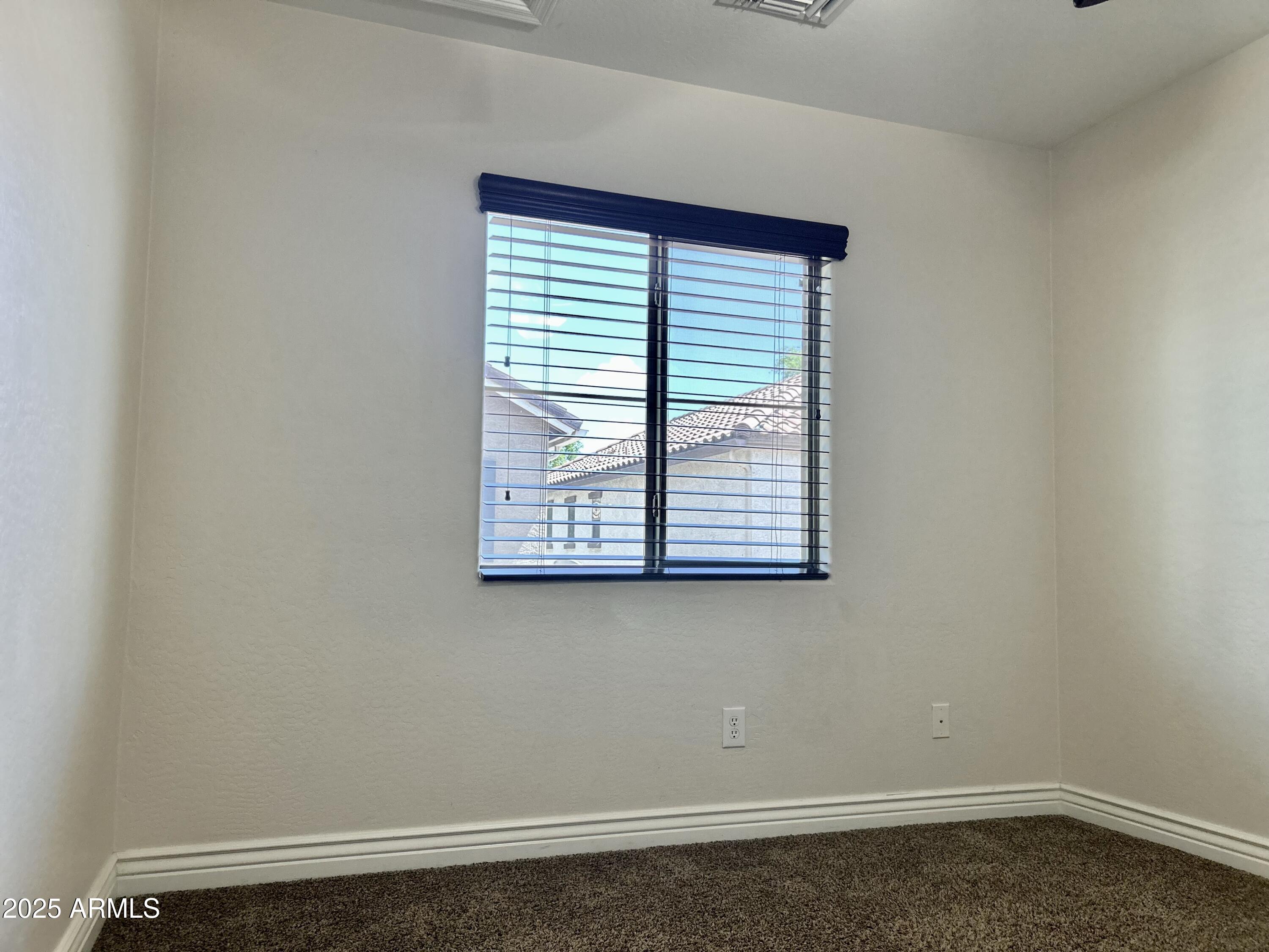 3853 East Santa Fe Lane Gilbert, AZ 85297 - Photo 18 of 23 an empty room with a window