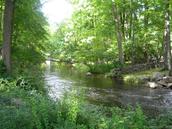 a view of lake with green space