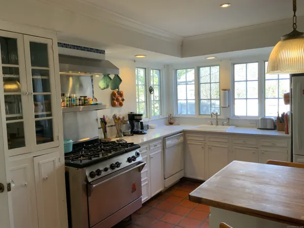 a kitchen with a stove and a sink