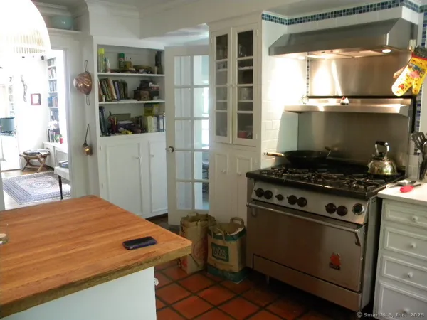 a kitchen with a stove and a microwave