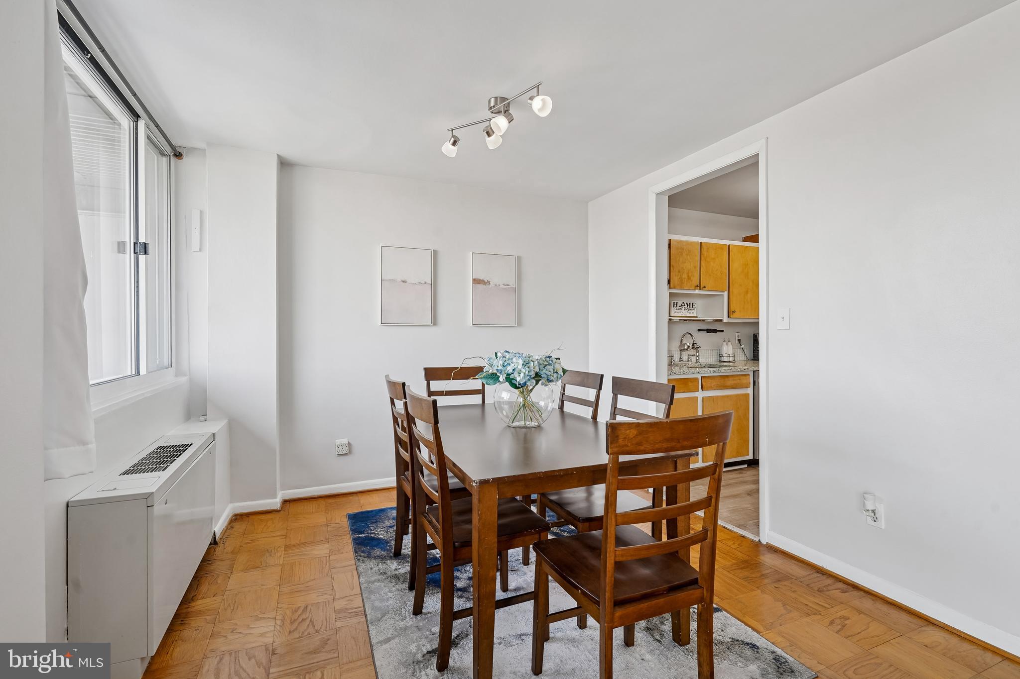 4343 Cherry Hill Road, Unit 705 Arlington, VA 22207 - Photo 15 of 38 a view of a dining room with furniture and wooden floor
