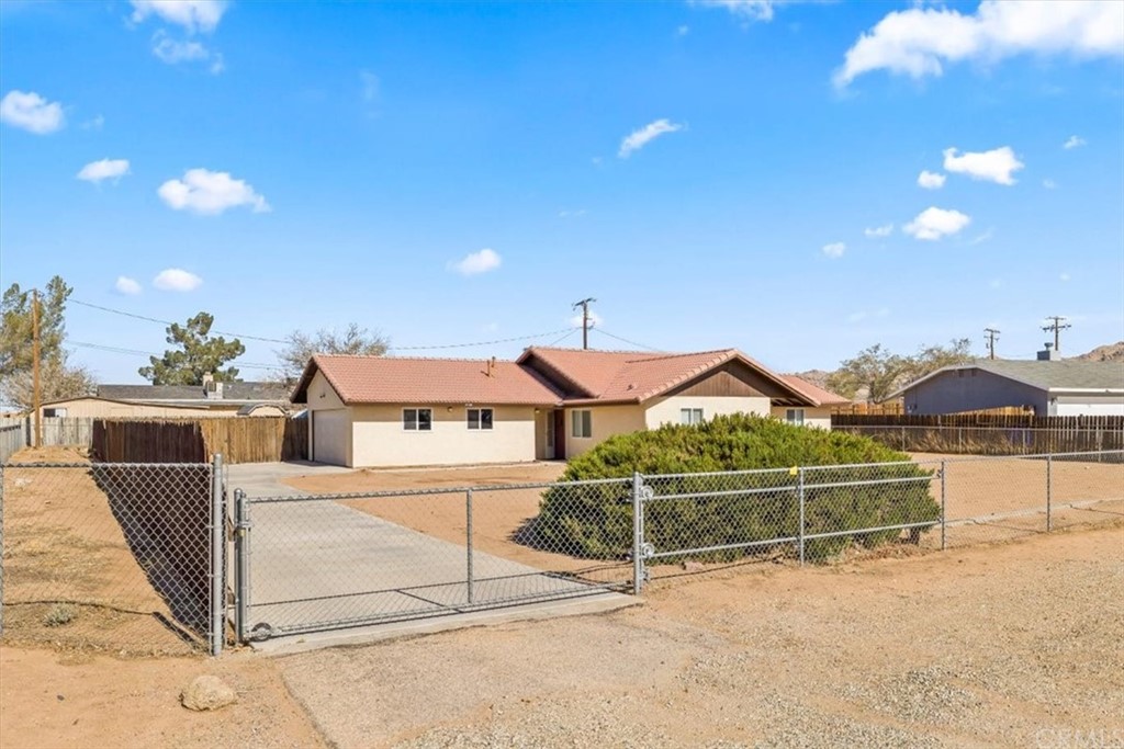 21726 Soboba Road Apple Valley, CA 92307 - Photo 1 of 1 a view of a house with a yard
