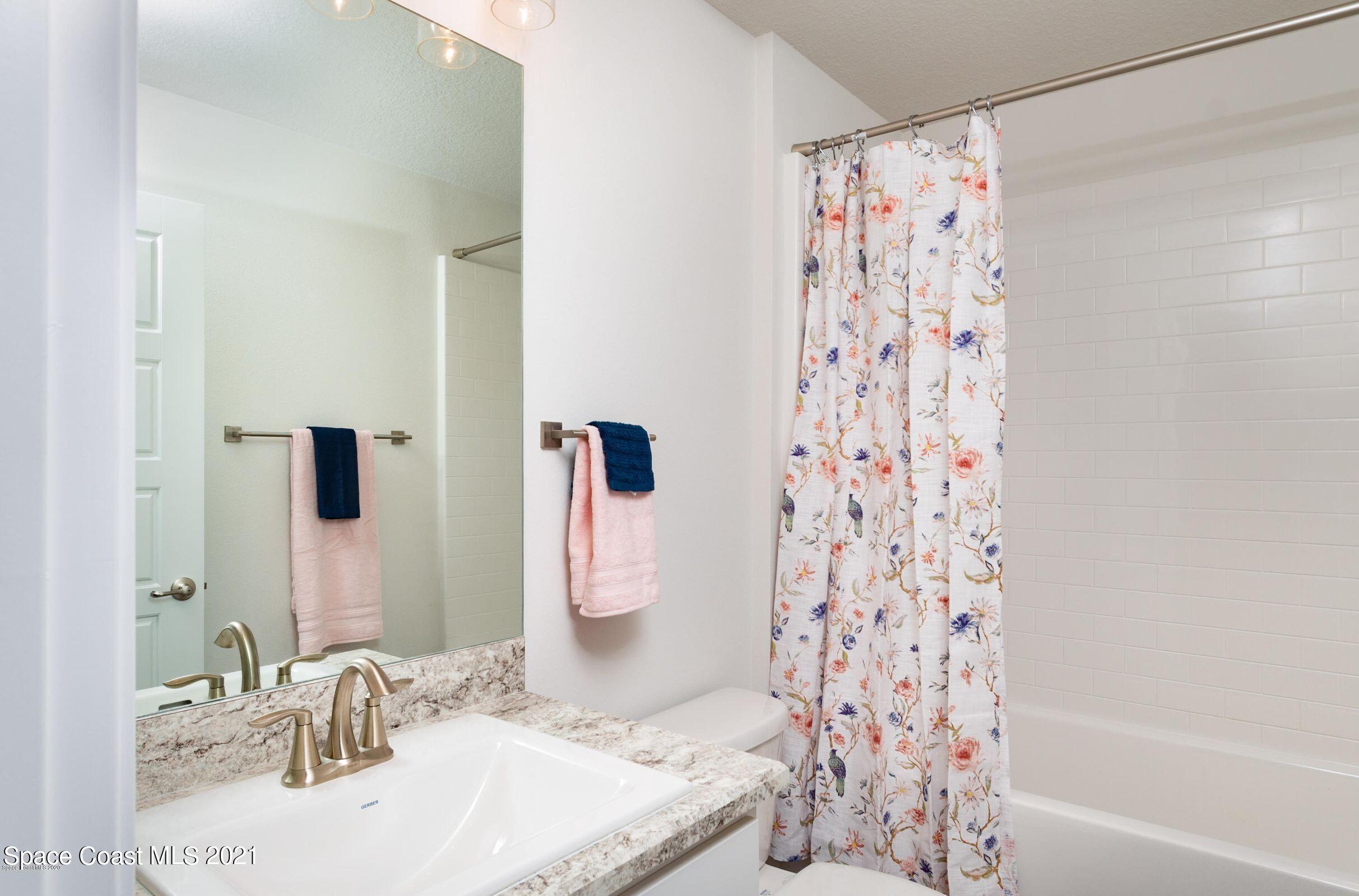 981 Degroodt Road Southwest, Unit 32 Palm Bay, FL 32908 - Photo 9 of 17 a bathroom with a sink and a mirror