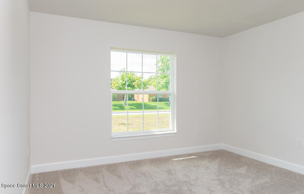 981 Degroodt Road Southwest, Unit 32 Palm Bay, FL 32908 - Photo 10 of 17 an empty room with a window