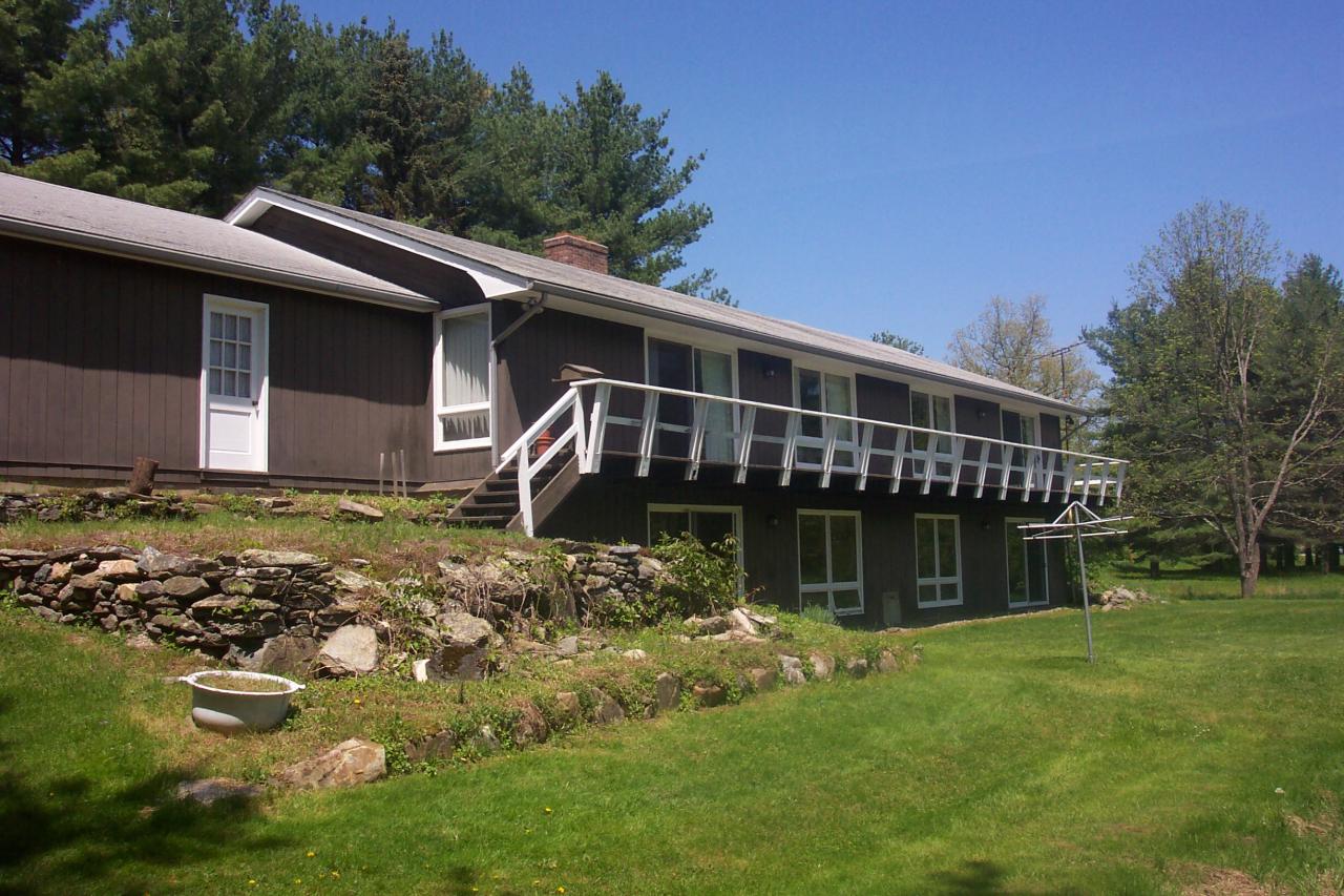 1 Glendale Road Stockbridge, MA 01262 - Photo 2 of 5 a house with swimming pool in front of it