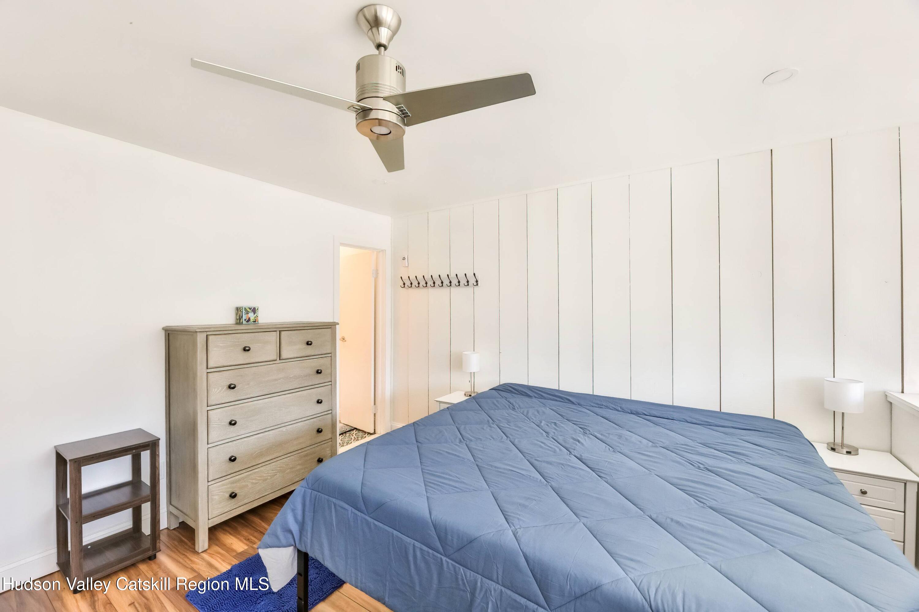 59 Scribner Hollow Road, Unit B2 Hunter, NY 12442 - Photo 20 of 42 a bedroom with a bed and a dresser