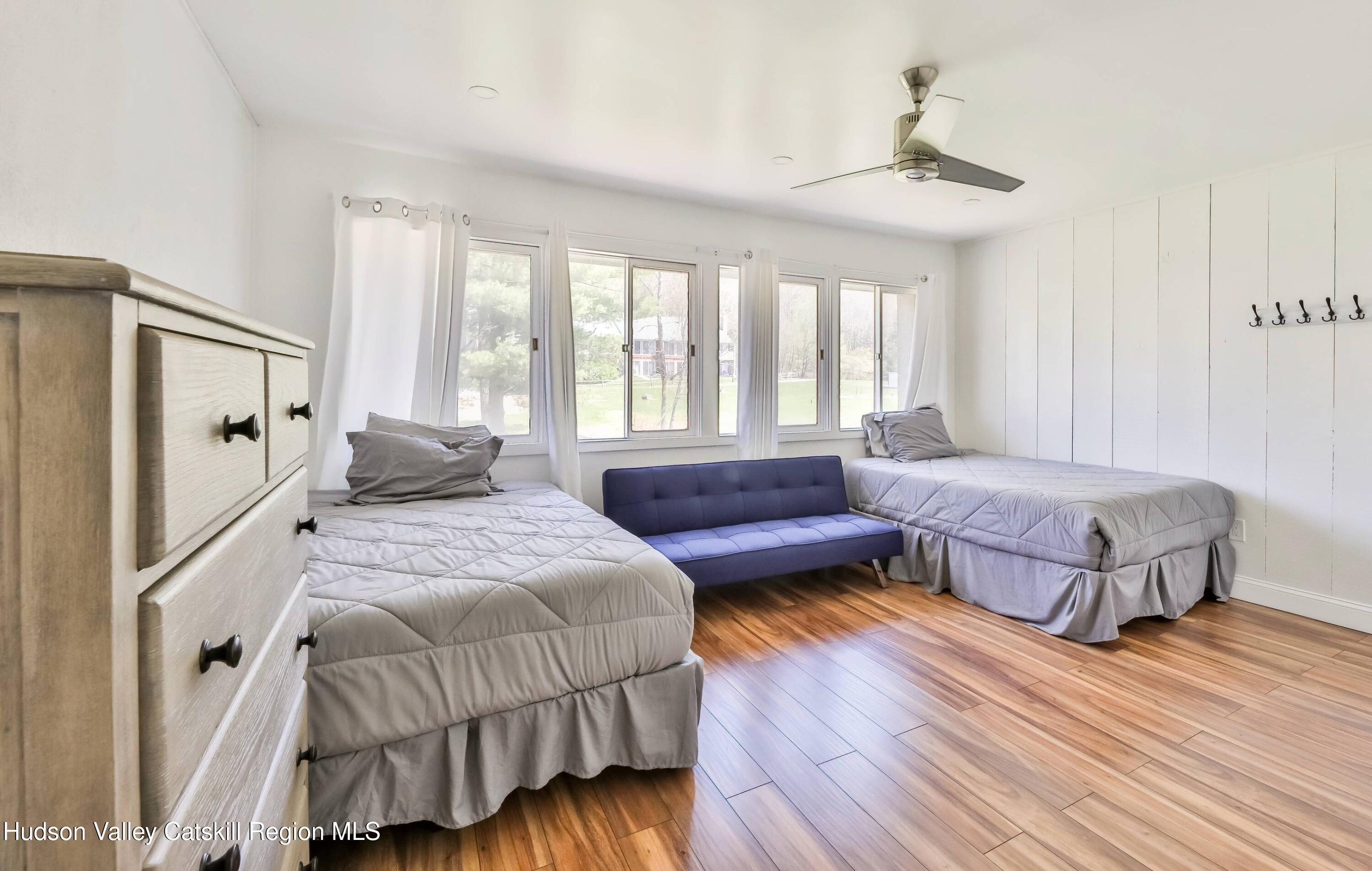 59 Scribner Hollow Road, Unit B2 Hunter, NY 12442 - Photo 22 of 42 a spacious bedroom with a bed and window