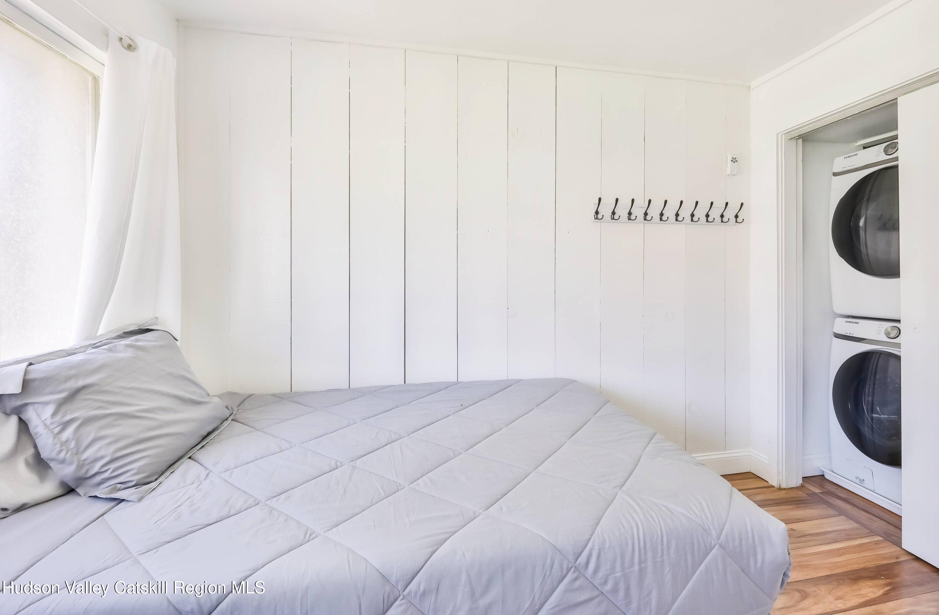 59 Scribner Hollow Road, Unit B2 Hunter, NY 12442 - Photo 24 of 42 a bedroom with a bed and a closet