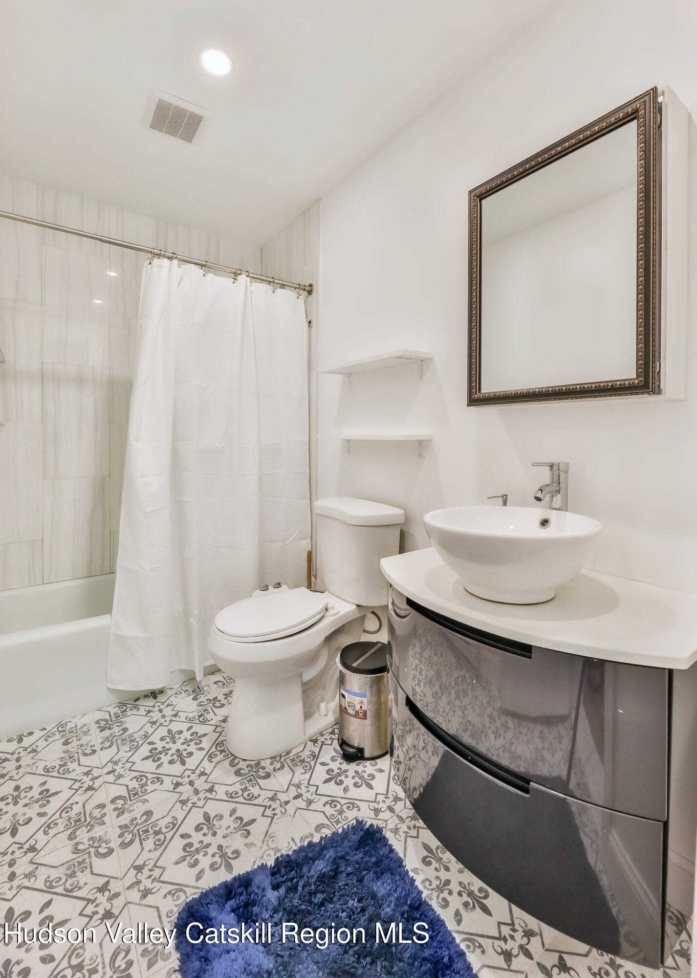59 Scribner Hollow Road, Unit B2 Hunter, NY 12442 - Photo 35 of 42 a bathroom with a sink toilet and shower