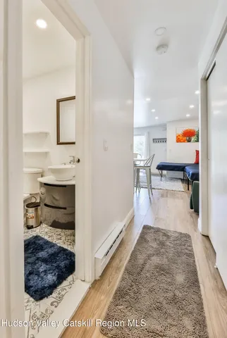 a spacious bedroom with a bed and a window